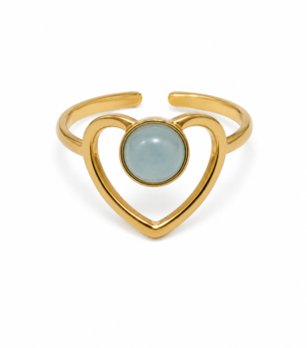 A delicate heart design highlighted by a striking blue stone.
