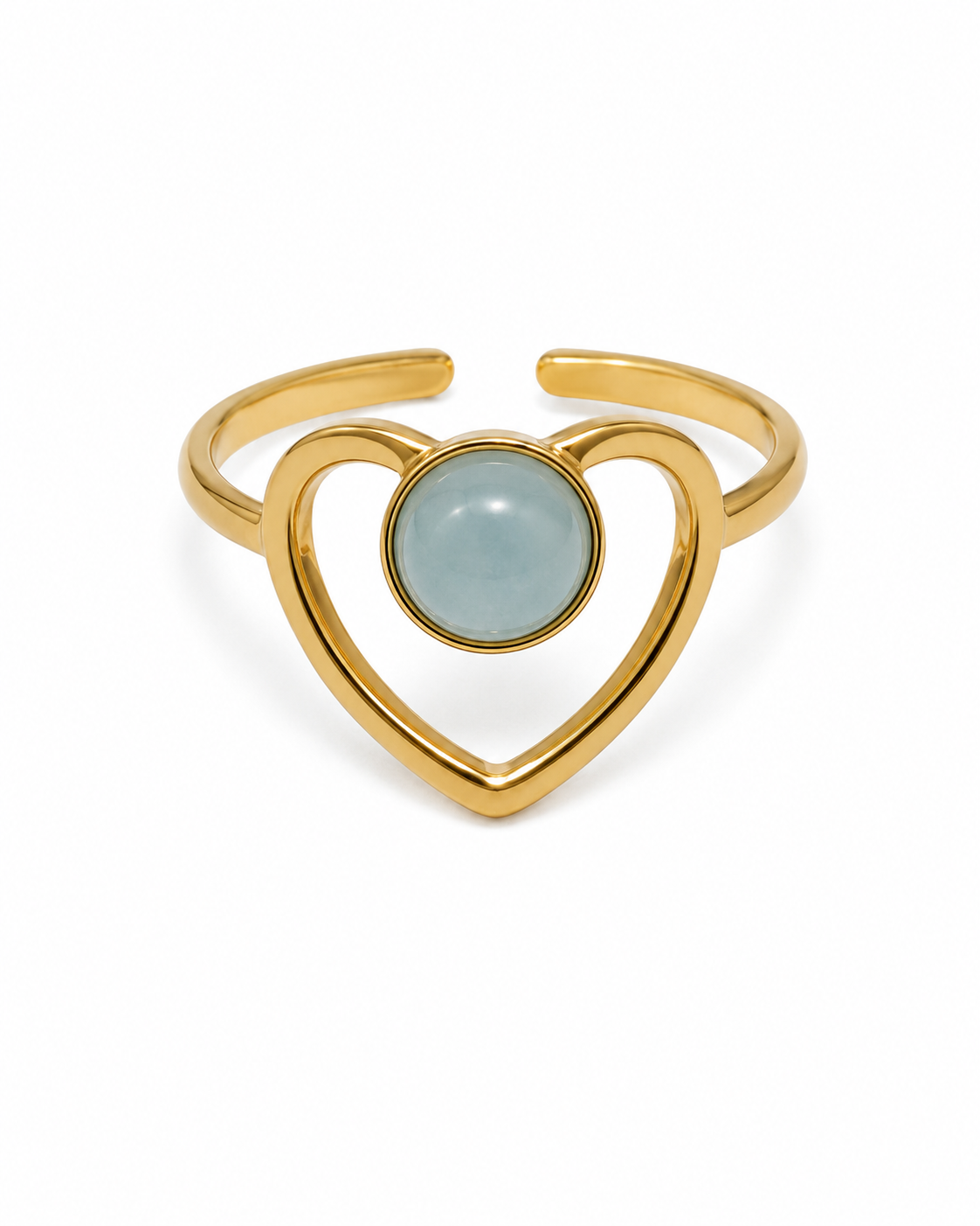 A delicate heart design highlighted by a striking blue stone.