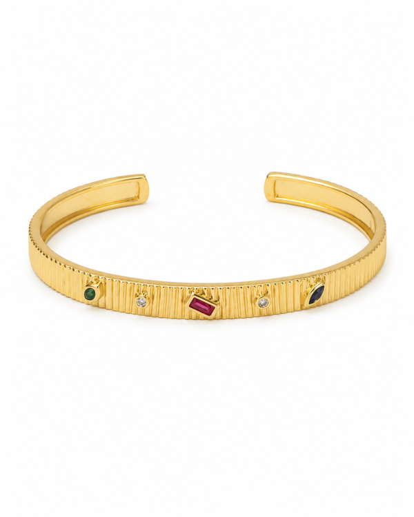 — A radiant gold-tone bracelet adorned with colorful stones for a vibrant luxury finish.
