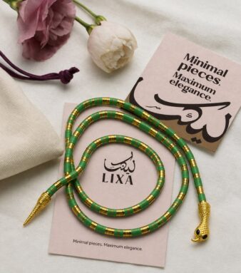 A bold snake-inspired choker finished in rich green for a striking statement.